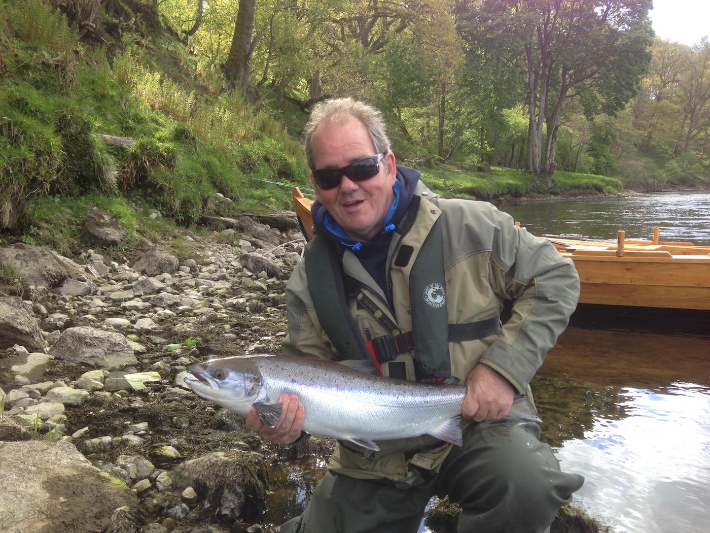 Here's a very fortunate River Tay salmon fishing trip guest Willie Logan holding a perfect 'sparkler' of a fresh run Spring salmon which was caught in the channel at the neck of the Kinnaird Beat's Rock Pool. This beautiful fish was quickly released back to the Tay by his salmon fishing guide to continue its upstream migration.