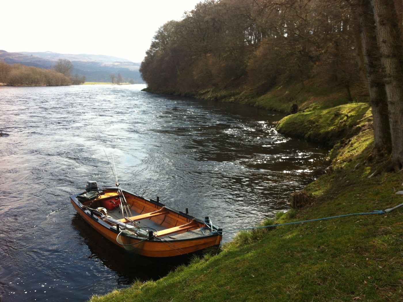 This perfect River Tay 'coble' boat at the ready stirs my blood in perfect water and light conditions like this. This photo was taken at the tail of the March Pool on the Kinnaird Beat of the Tay during Springtime.