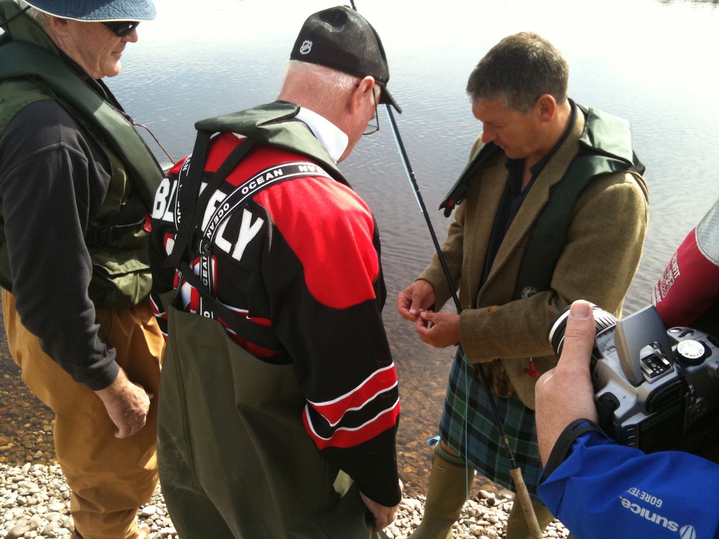 Here's Scottish salmon guide Jock Monteith showing a group of Canadian salmon fishing holiday guests how best to tie on a salmon fly. Much salmon fishing technical information is delivered to the fishing guests on a guided salmon fishing day including Spey casting lessons, how to move effectively between each cast and how to set the hook when a salmon takes the fly.