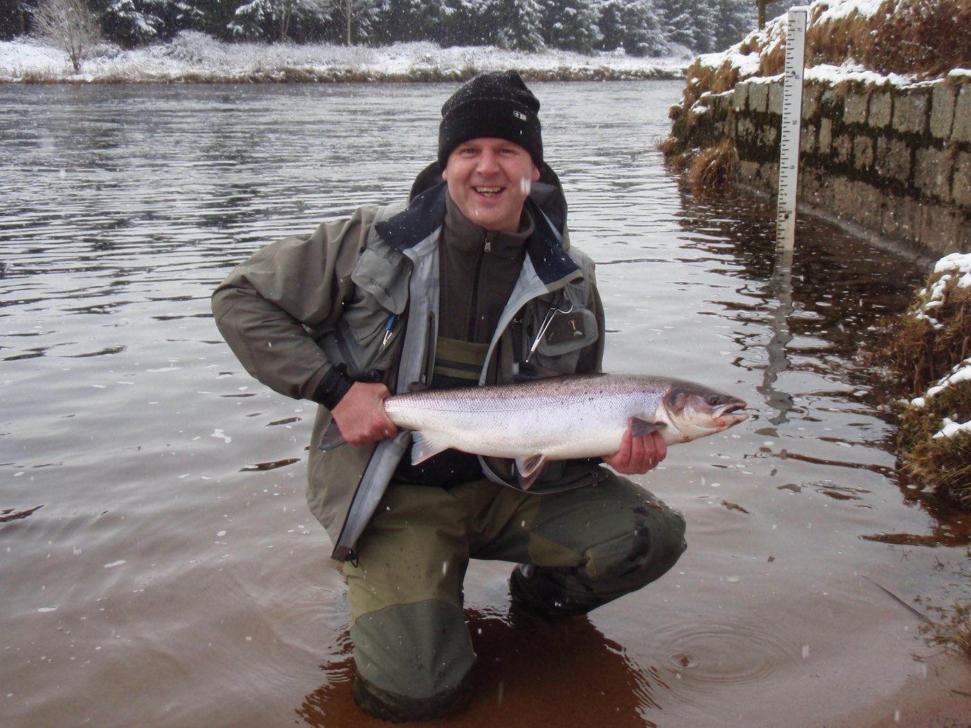 Here's a perfect fresh run February Spring salmon which was caught in front of the Park North Beat fishing hut during February by my colleague Russell Kay. Early Spring fish like this can be a real challenge to get your fly in front of but if you do they're always keen to take a fly like this fine specimen. You can see the Park Beat water gauge behind Russell in the shot.