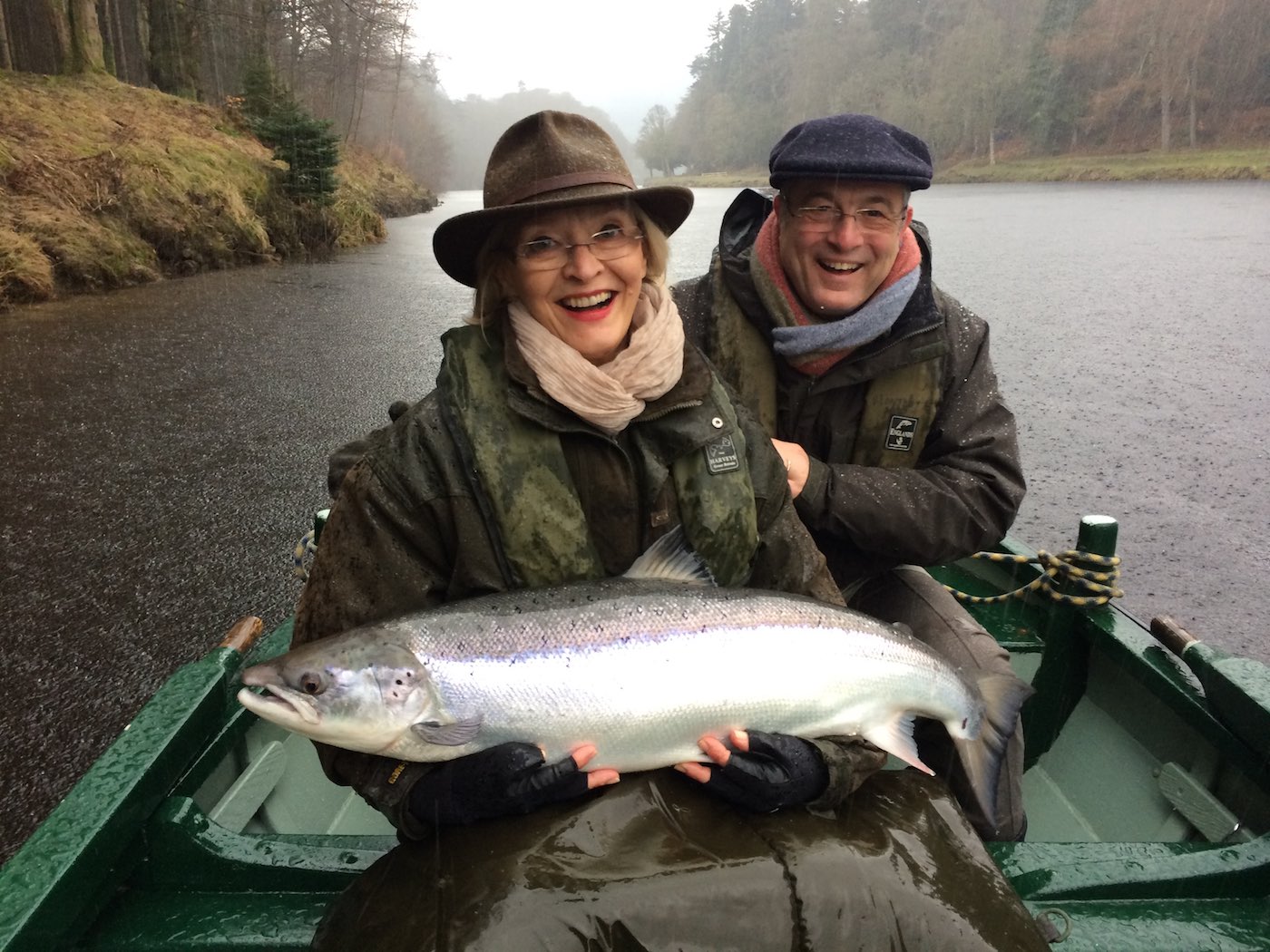 Here's a lady salmon fishing guest Mrs Caplin with a perfect March caught River Tay salmon of 23lbs which was caught upstream of the Dunkeld Bridge with the assistance of her professional salmon guide. This fish was caught on a cold wet Spring day but that didn't matter due to the accomplishment and excitement of the capture of this perfect Tay specimen.
