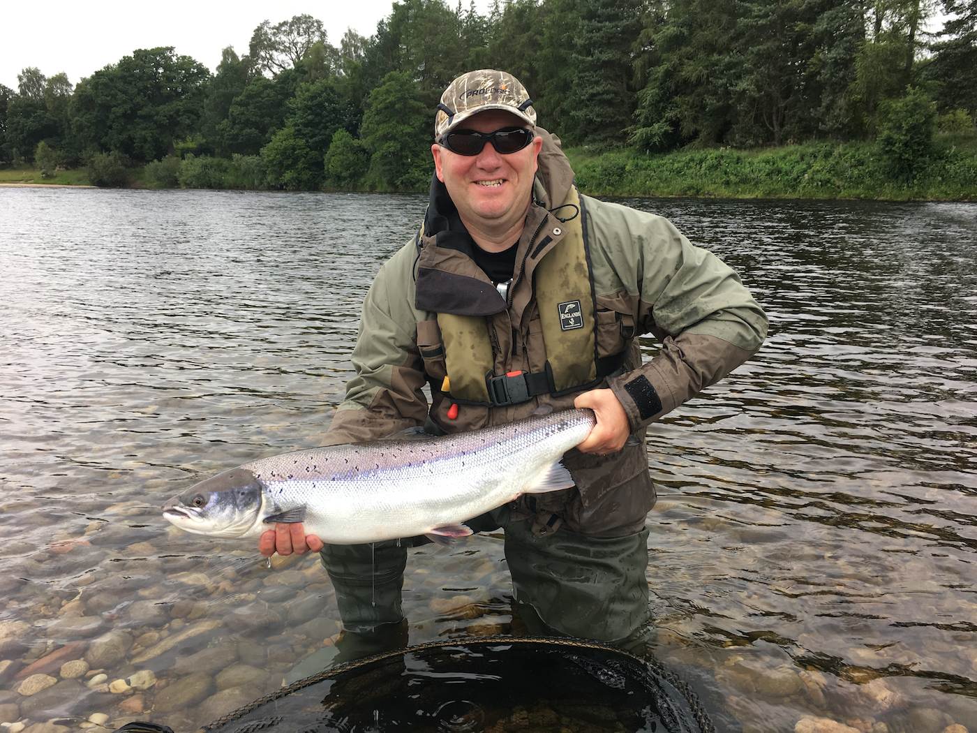 This fish was caught neat the Perthshire town of Murthly with this fortunate salmon angler's very first cast of the fly while I was serving as his personal salmon fishing guide. Sometime salmon can surprise the angler and his guide by showing up at the very start of the fishing day. This fine fish was caught in the Cottage Stream Pool on the Kercock salmon beat of the River Tay.