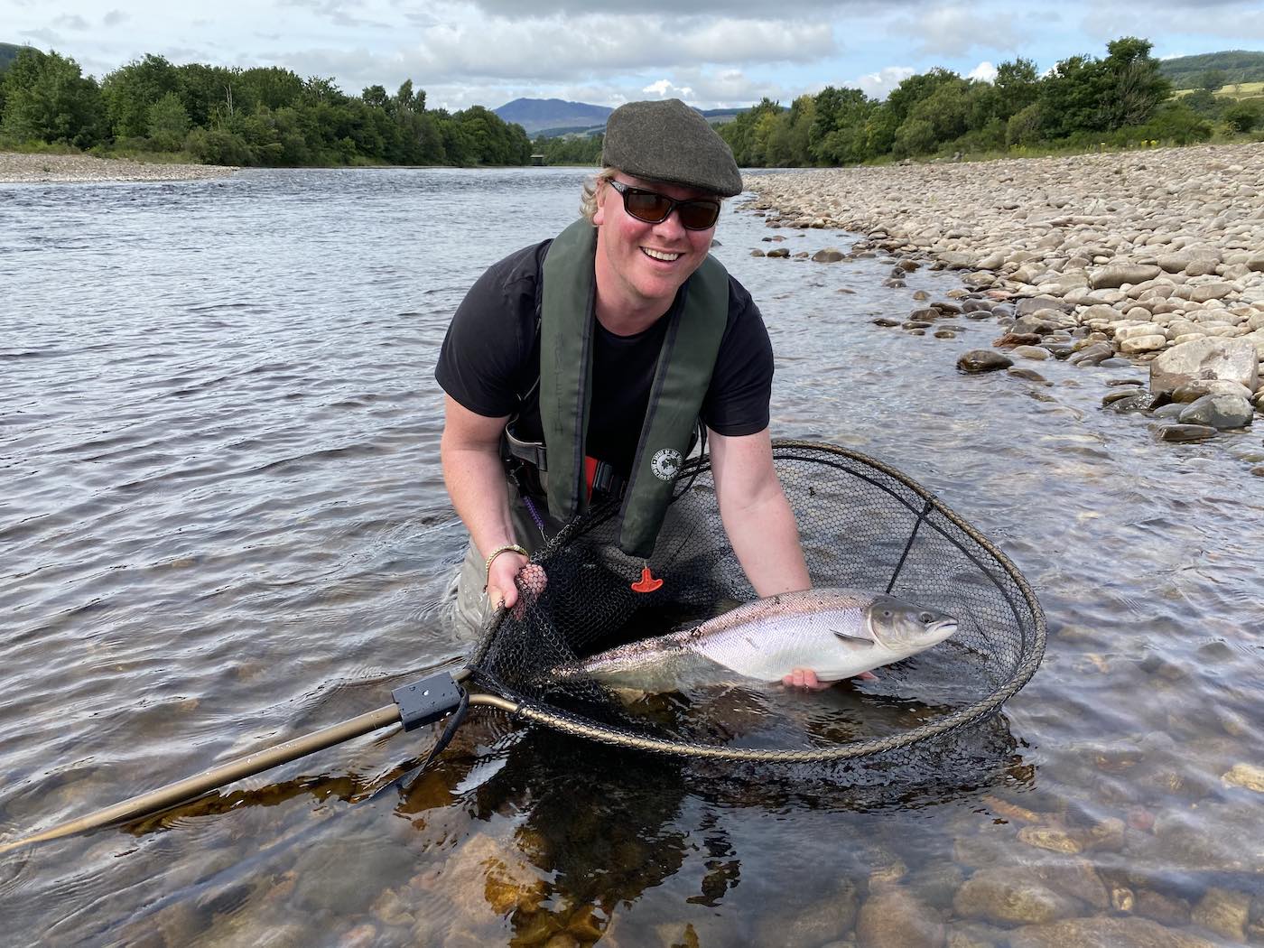 Here's a lovely fly caught salmon by one of our guided fishing guests which was caught on the River Tummel neat Ballinluig in July. This fishing area of the Tummel is close to Dunkeld & Pitlochry. You can see the salmon is being perfectly supported by this salmon fisher while I took the salmon capture shot as his salmon fishing guide.