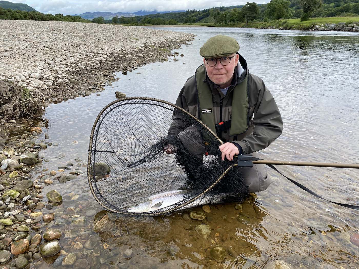 Here's a fine salmon capture photograph for River Tay salmon angler Martin Hunter at the famous Ash Tree Pool of the River Tay near Dunkeld. A personal guide always provides a salmon fishing advantage and even to experienced salmon fishers like Martin. I was Martin's personal salmon guide that day and took this perfect salmon capture shot.