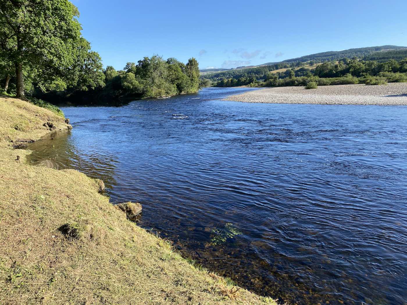 A River Tay salmon guide will take you to the best fishing areas and will make sure you're fishing through them optimally. If you are new to the sport a guide will teach all of the basic fly fishing skills and will supply all of the required fishing equipment and permit access. This is an upstream shot of the March Pool on the River Tay opposite the River Tummel mouth. Look at the perfectly strimmed riverbank I completed for the benefit & safety of our many visiting River Tay salmon fishing trip guests.