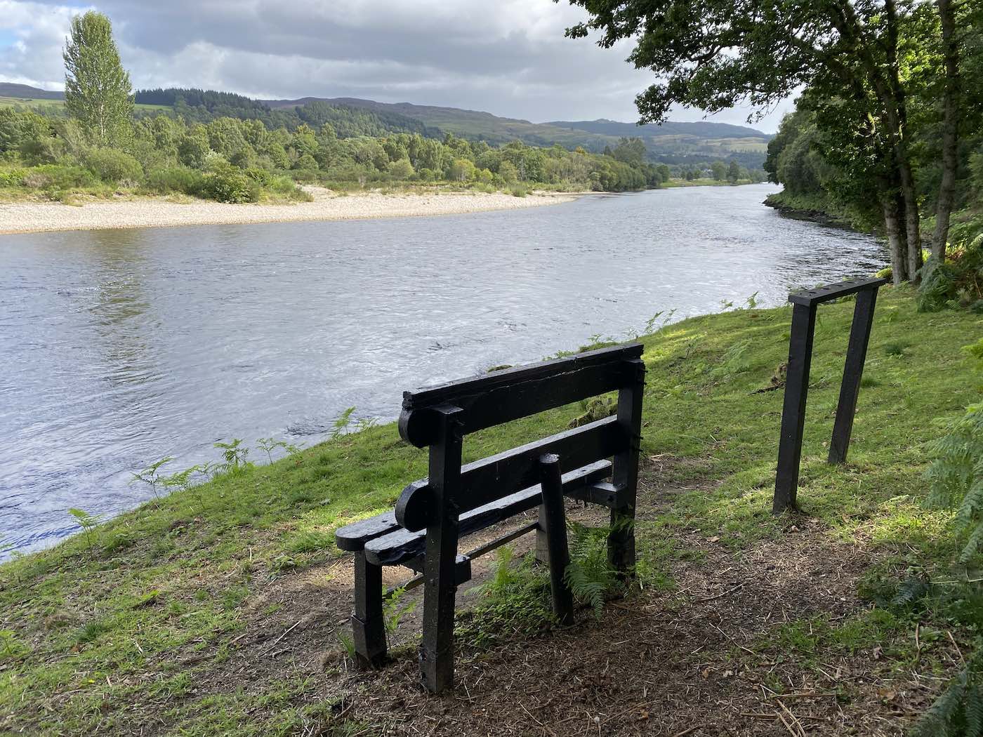 This old bench was found hanging from a riverbank tree 1 mile upstream of its now perfect location directly in front of the  River Tay & River Tummel confluence following an early Spring flood. As soon as I saw the bench and had salvaged it I knew exactly where it was going to be re-sited and its now been here in this perfect elevated riverside location for the last decade. This is the most perfect seat for observing one of the most beautiful areas or the entire River Tay from. I added the accompanying rod rest rack in too as you can see.